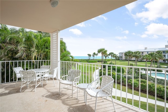 balcony featuring a water view