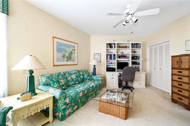 carpeted home office with ceiling fan