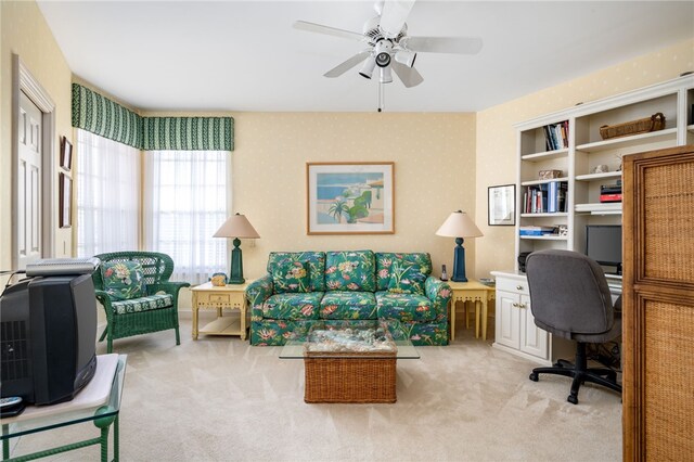 office area featuring ceiling fan and light colored carpet