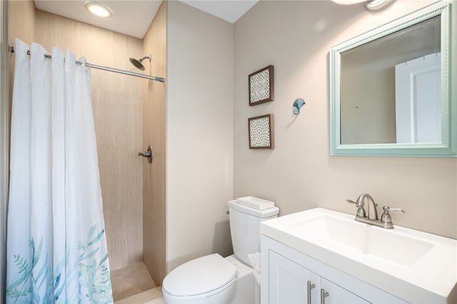 bathroom with toilet, vanity, and a shower with shower curtain