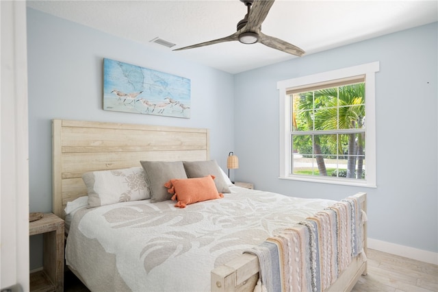 bedroom featuring light hardwood / wood-style flooring and ceiling fan