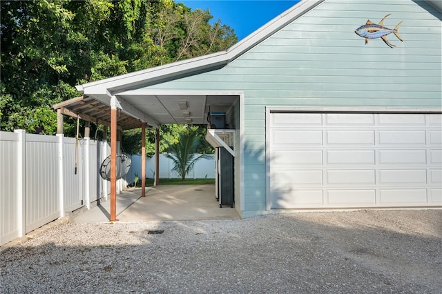 garage featuring a carport