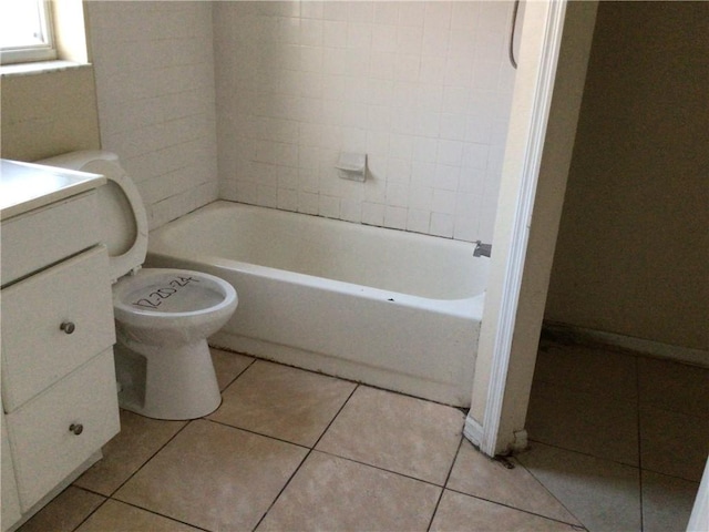 bathroom featuring tile patterned flooring, vanity, and toilet