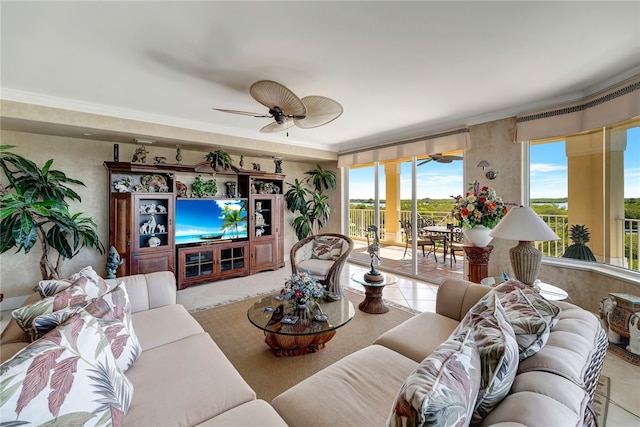 living room featuring ceiling fan, light tile patterned floors, and ornamental molding