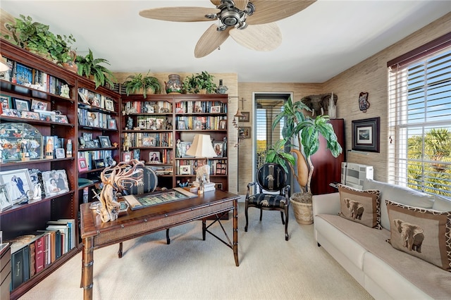 carpeted home office with ceiling fan