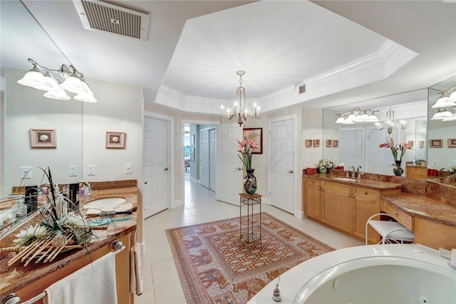 bathroom featuring a bathing tub, vanity, ornamental molding, and tile patterned floors