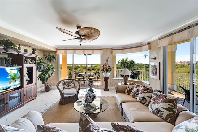 living room featuring ornamental molding, ceiling fan, and light tile patterned flooring