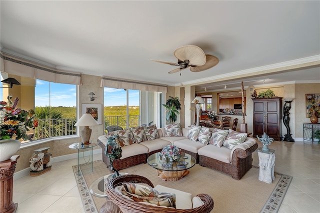 tiled living room with ceiling fan and ornamental molding