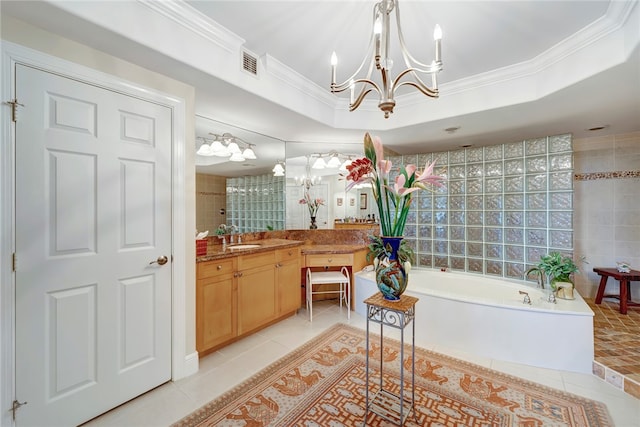 bathroom with vanity, tile patterned floors, a raised ceiling, and tile walls