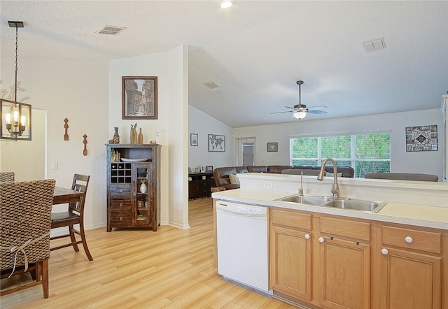 kitchen featuring white dishwasher, ceiling fan with notable chandelier, sink, decorative light fixtures, and light hardwood / wood-style floors