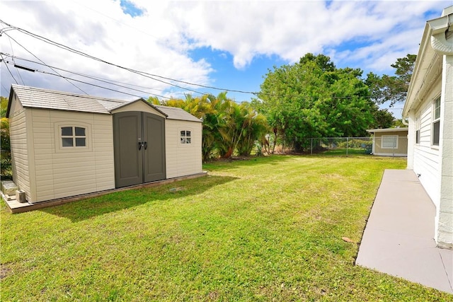 1311 3rd Ct, Vero Beach, FL 32960 - view of yard featuring a shed and an outbuilding