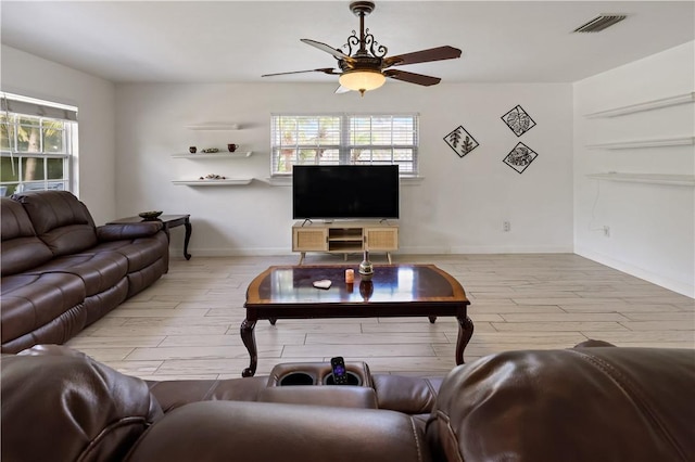 1311 3rd Ct, Vero Beach, FL 32960 - living room featuring ceiling fan, wood finished floors, and baseboards