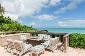 view of patio / terrace with a water view and an outdoor hangout area