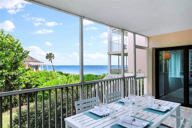 balcony featuring a water view