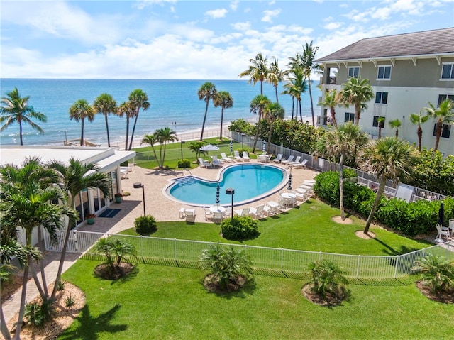 3554 Ocean Dr Unit 403S, Vero Beach, FL 32963 - community pool featuring a water view, a fenced backyard, and a patio