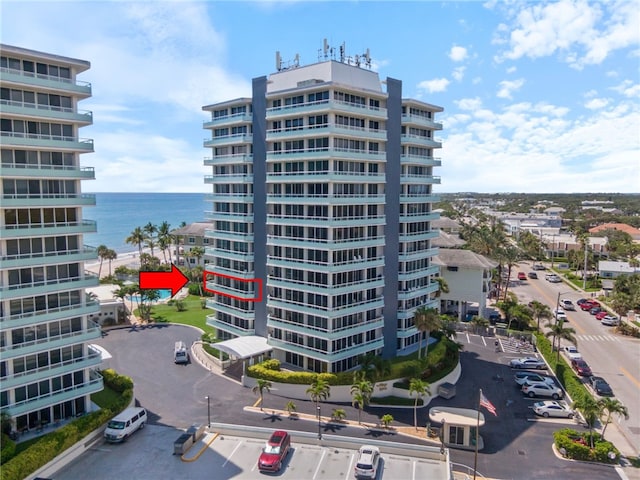 3554 Ocean Dr Unit 403S, Vero Beach, FL 32963 - view of apartment building / complex with uncovered parking and a water view