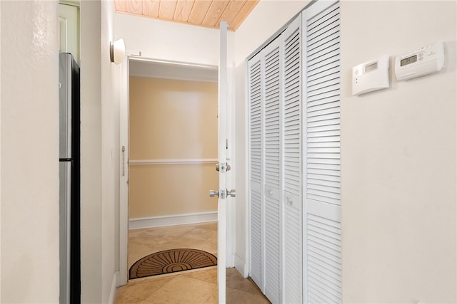 hallway featuring light tile patterned floors