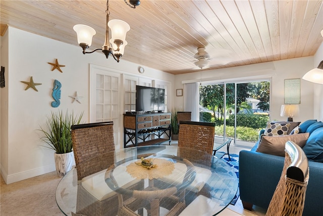 tiled dining room featuring ceiling fan with notable chandelier and wood ceiling