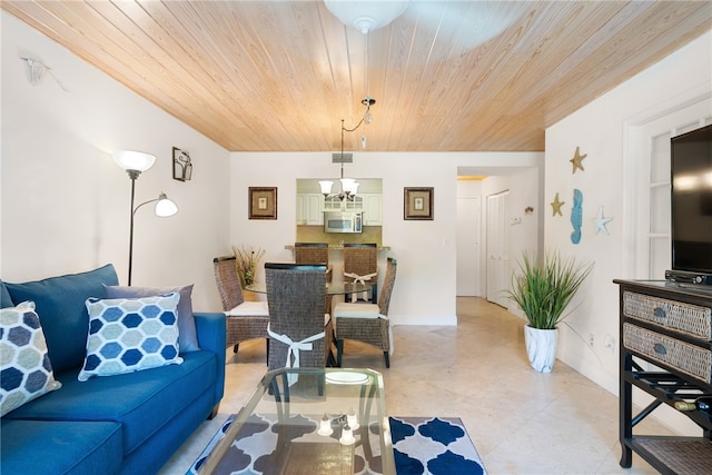 living room with an inviting chandelier and wood ceiling