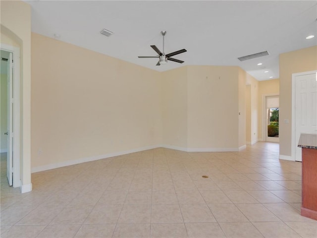 tiled empty room featuring ceiling fan