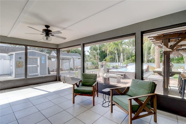 sunroom with ceiling fan