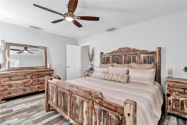 bedroom featuring ceiling fan and light hardwood / wood-style floors