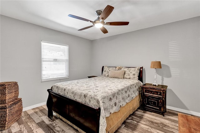 bedroom featuring hardwood / wood-style flooring and ceiling fan