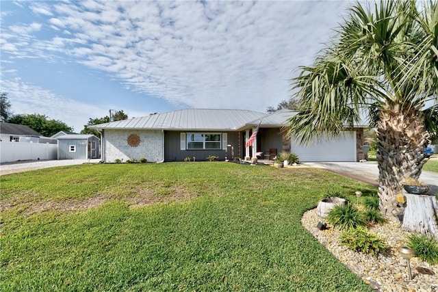 view of front of home featuring a garage and a front lawn