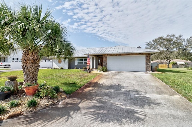 single story home featuring a front yard and a garage