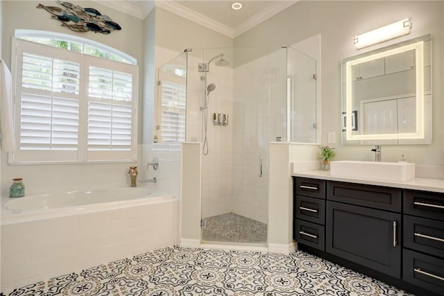 bathroom with tile patterned flooring, vanity, ornamental molding, and independent shower and bath