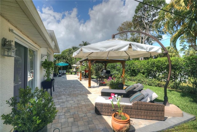 view of patio with a gazebo and an outdoor hangout area