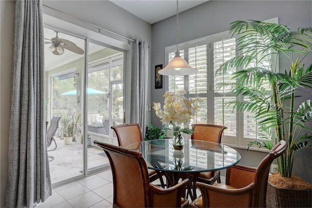 dining room with ceiling fan and light tile patterned flooring