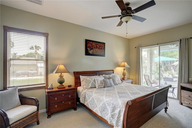 carpeted bedroom with access to exterior and ceiling fan