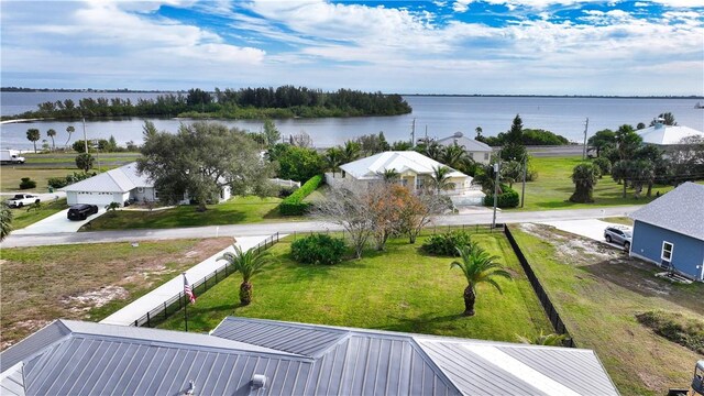 birds eye view of property with a water view