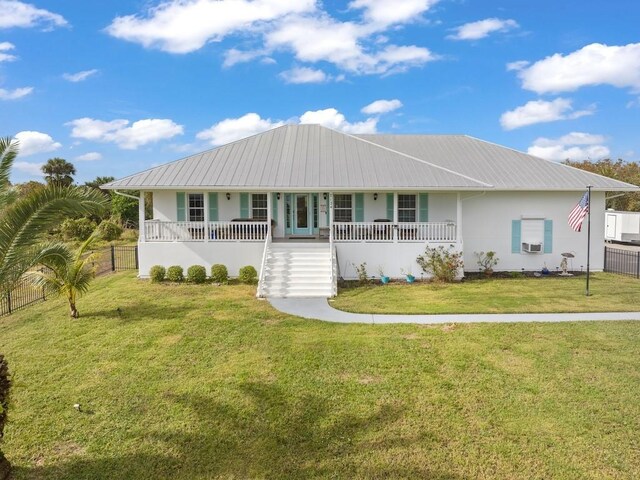 view of front facade with covered porch and a front yard