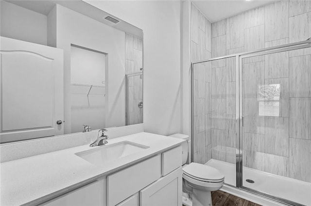 8255 97th Ave, Vero Beach, FL 32967 - bathroom with a stall shower, vanity, and wood finished floors