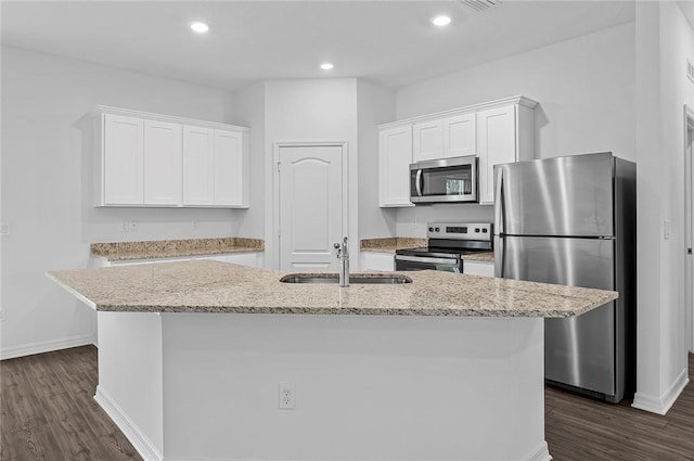 8255 97th Ave, Vero Beach, FL 32967 - kitchen featuring stainless steel appliances, white cabinetry, an island with sink, dark wood-style floors, and recessed lighting