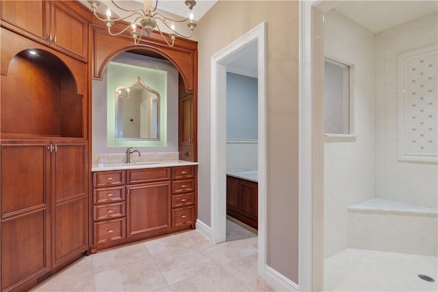 104 Island Plantation Ter Unit 304, Vero Beach, FL 32963 - full bath with an inviting chandelier, a walk in shower, tile patterned floors, and vanity
