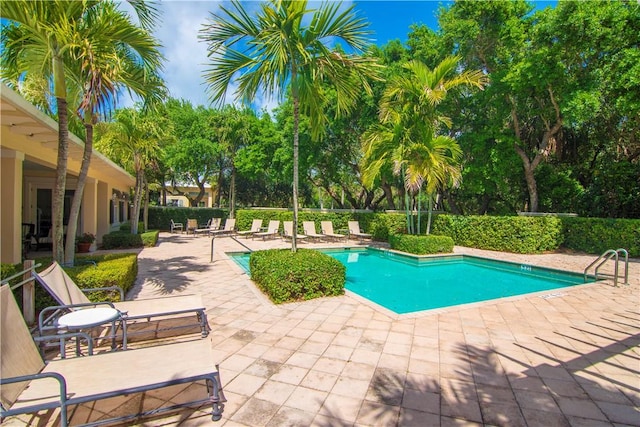 104 Island Plantation Ter Unit 304, Vero Beach, FL 32963 - pool featuring a patio area and fence