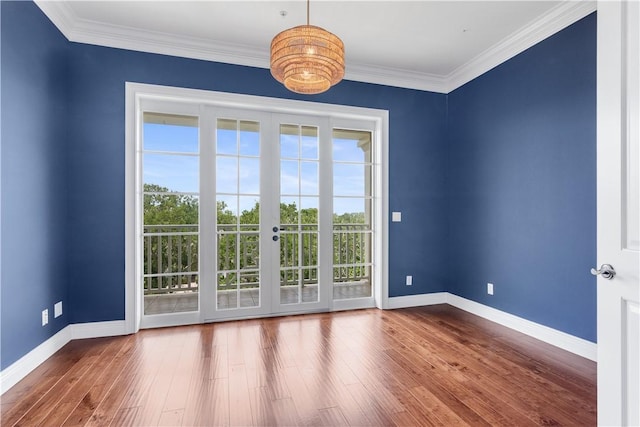 104 Island Plantation Ter Unit 304, Vero Beach, FL 32963 - empty room with crown molding, wood finished floors, and baseboards