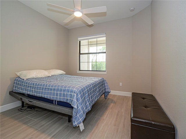 bedroom with hardwood / wood-style floors and ceiling fan