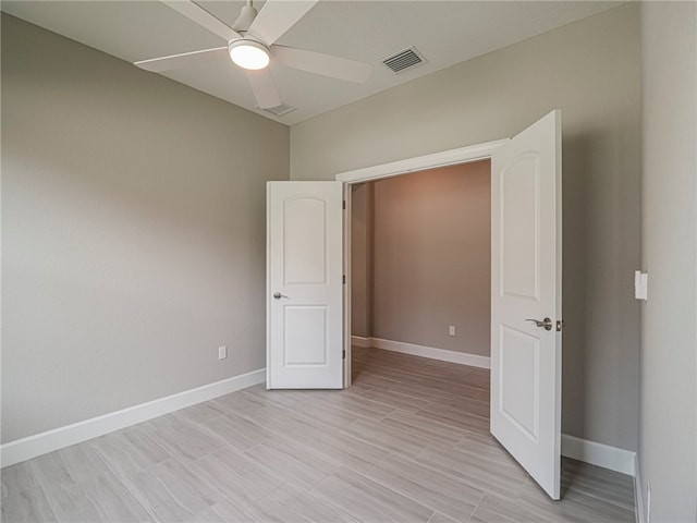 unfurnished bedroom featuring light hardwood / wood-style floors and ceiling fan