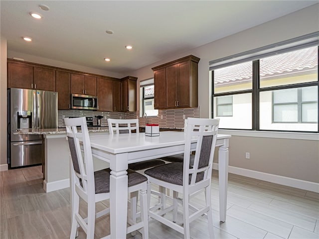 dining area featuring a healthy amount of sunlight