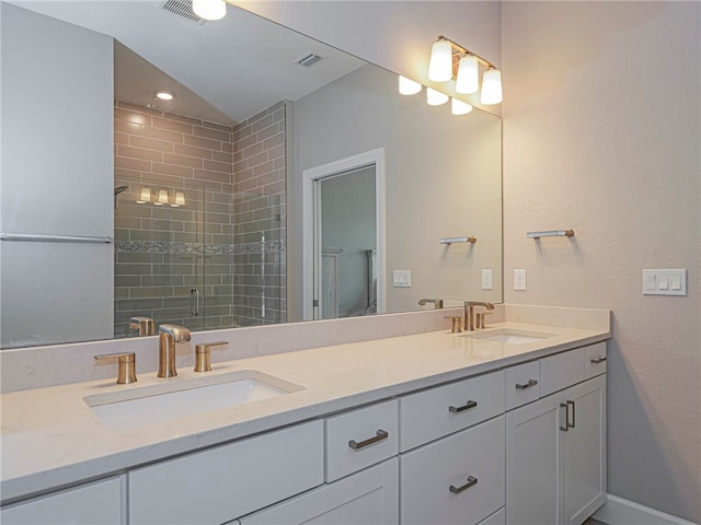 bathroom with vanity and a shower with shower door