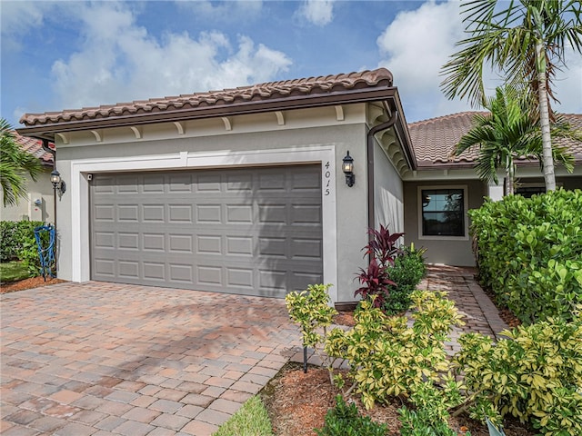 mediterranean / spanish-style house featuring a garage