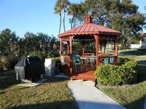 exterior space featuring a gazebo and a lawn