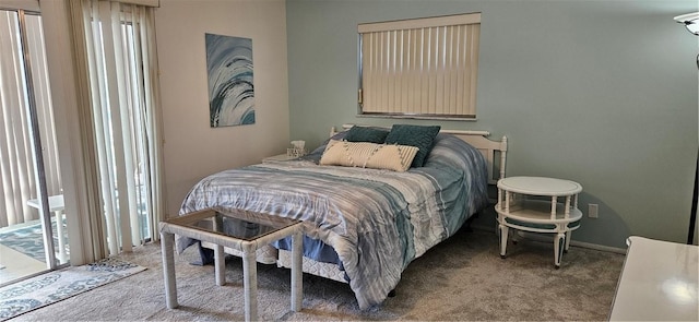 carpeted bedroom featuring access to exterior