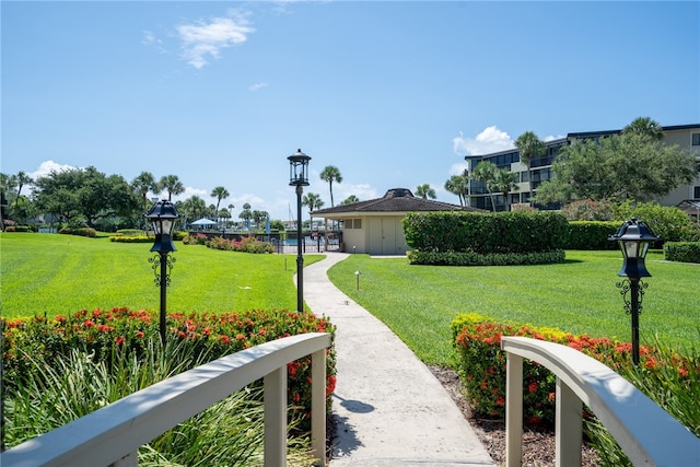 view of home's community with a yard