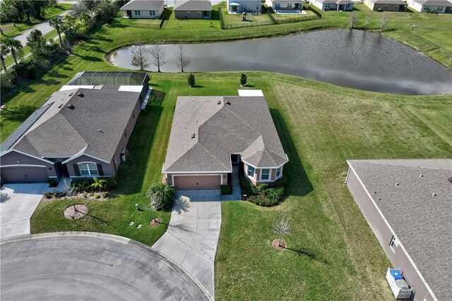 view of front of property with a garage and a front lawn