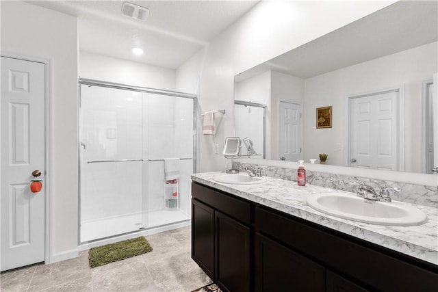 bathroom with vanity and an enclosed shower